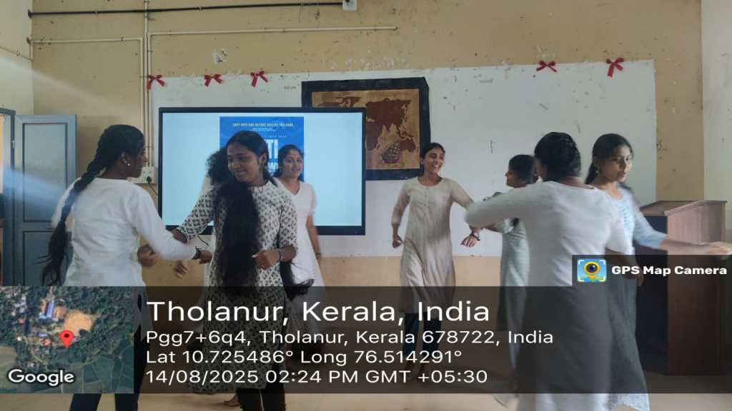 Students participating in an anti-ragging awareness event, engaged in a performance or presentation in a classroom setting.